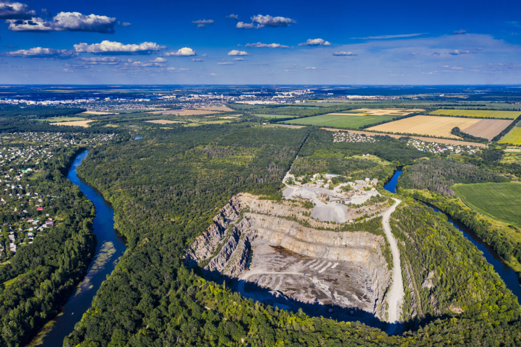 a mine site within close proximity to farmland, forestry and a nearby river